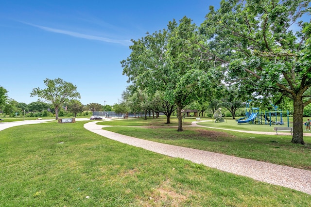 view of property's community featuring a yard