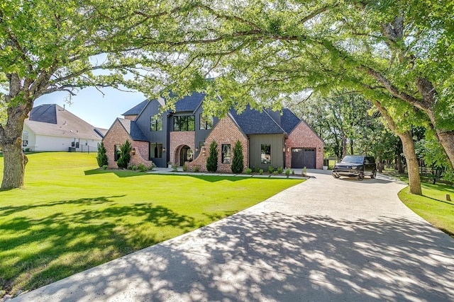 7758 Barber Ranch Rd, Fort Worth, TX 76126 - view of front of property with brick siding, asphalt driveway, an attached garage, and a front yard