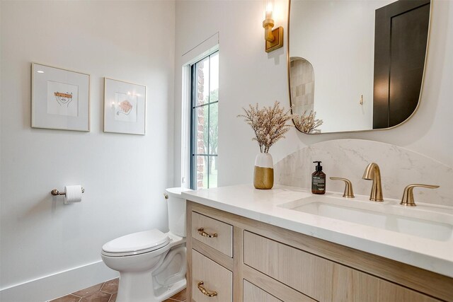 7758 Barber Ranch Rd, Fort Worth, TX 76126 - bathroom with toilet, vanity, baseboards, and tile patterned flooring