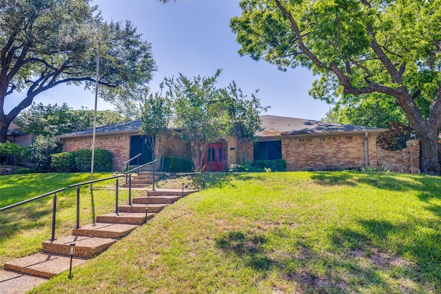 1950 Hidden Vly, Rockwall, TX 75087 - view of front facade featuring brick siding and a front lawn