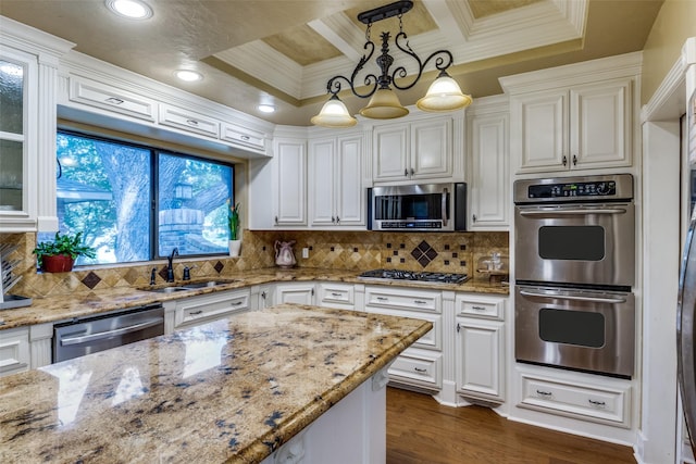 1950 Hidden Vly, Rockwall, TX 75087 - kitchen featuring stainless steel appliances, a sink, white cabinetry, ornamental molding, and coffered ceiling