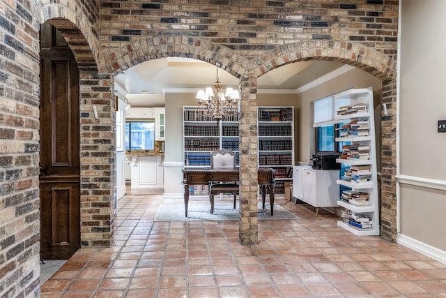 1950 Hidden Vly, Rockwall, TX 75087 - dining room featuring crown molding, arched walkways, a chandelier, baseboards, and light tile patterned floors