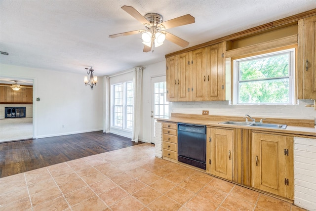 1405 Southwood Blvd, Arlington, TX 76013 - kitchen with dishwasher, a sink, ceiling fan, light countertops, and a chandelier