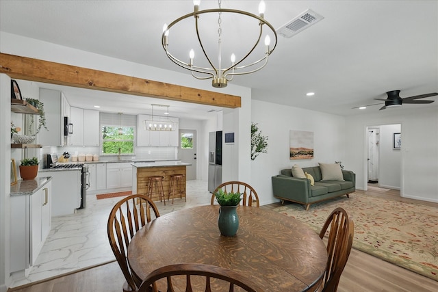 810 Turner Blvd, Grand Prairie, TX 75050 - dining space with a chandelier, recessed lighting, a ceiling fan, and light marble finish flooring