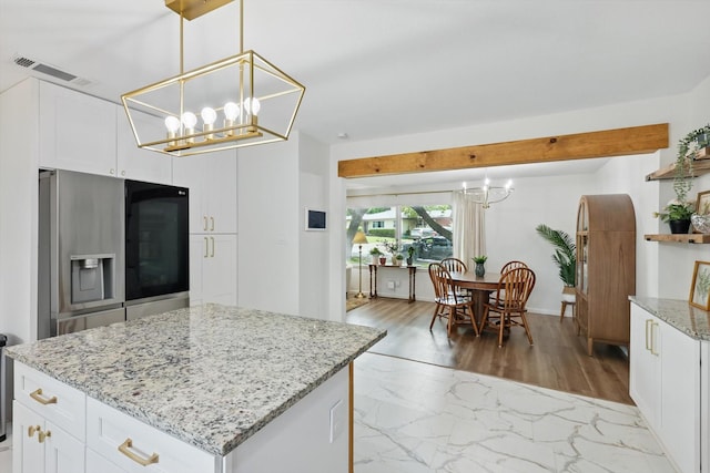 810 Turner Blvd, Grand Prairie, TX 75050 - kitchen featuring a chandelier, stainless steel refrigerator with ice dispenser, open shelves, light stone countertops, and white cabinets
