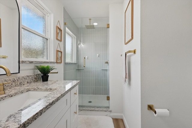 810 Turner Blvd, Grand Prairie, TX 75050 - bathroom featuring a shower stall, vanity, baseboards, and wood finished floors