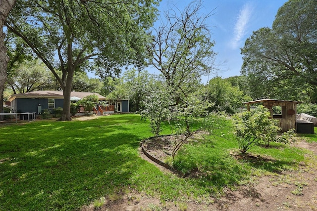 810 Turner Blvd, Grand Prairie, TX 75050 - view of green lawn with a shed and an outdoor structure