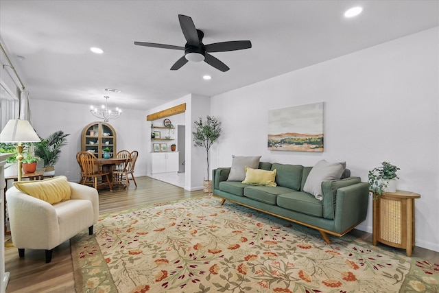 810 Turner Blvd, Grand Prairie, TX 75050 - living room featuring a chandelier, wood finished floors, recessed lighting, and a ceiling fan