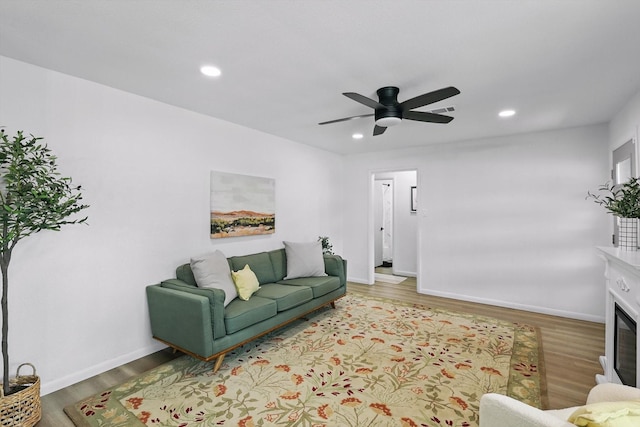 810 Turner Blvd, Grand Prairie, TX 75050 - living room with wood finished floors, a ceiling fan, recessed lighting, baseboards, and a glass covered fireplace
