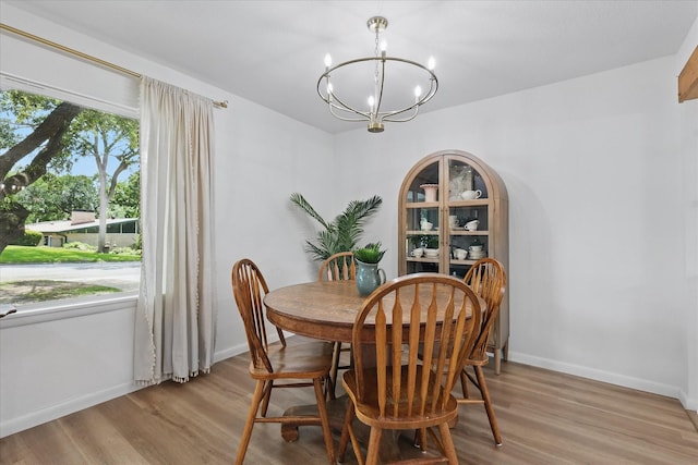 810 Turner Blvd, Grand Prairie, TX 75050 - dining space featuring a chandelier, light wood finished floors, and baseboards