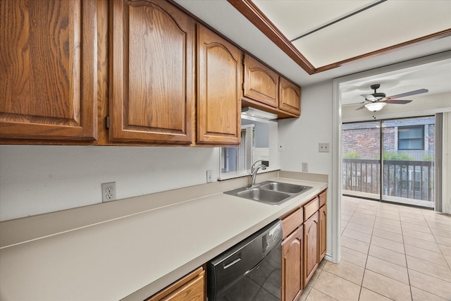 1206 Signal Ridge Pl, Rockwall, TX 75032 - kitchen with a sink, black dishwasher, light countertops, light tile patterned flooring, and brown cabinets