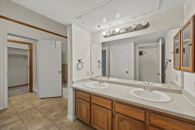 1206 Signal Ridge Pl, Rockwall, TX 75032 - bathroom featuring double vanity and tile patterned flooring