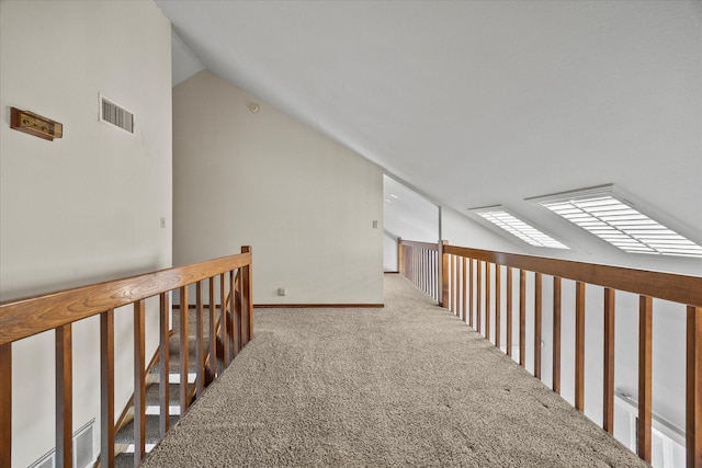 1206 Signal Ridge Pl, Rockwall, TX 75032 - hallway featuring vaulted ceiling, carpet flooring, and an upstairs landing