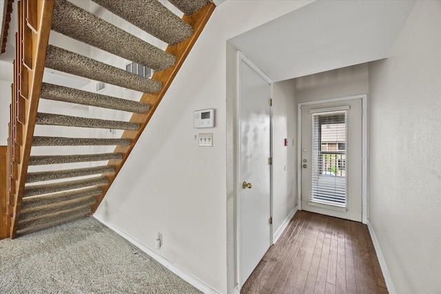 1206 Signal Ridge Pl, Rockwall, TX 75032 - entrance foyer featuring baseboards, stairs, and hardwood / wood-style floors