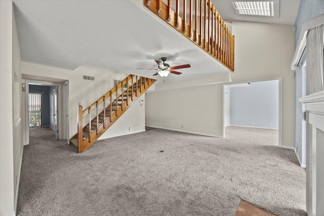 1206 Signal Ridge Pl, Rockwall, TX 75032 - unfurnished living room featuring stairs, carpet, a ceiling fan, and baseboards