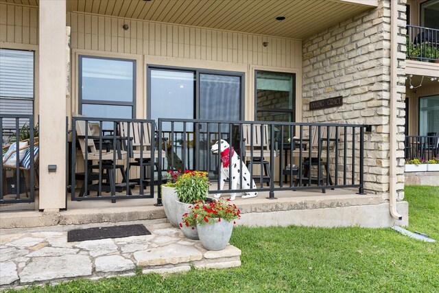 401 E Pearl St Unit 2105, Granbury, TX 76048 - doorway to property featuring stone siding