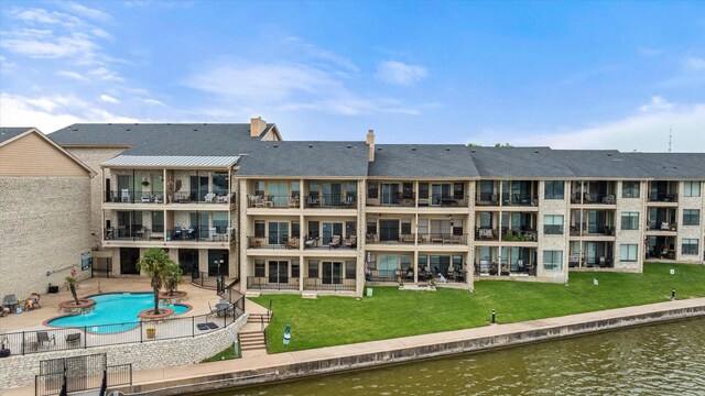 401 E Pearl St Unit 2105, Granbury, TX 76048 - back of property with a water view, fence, a community pool, and a patio area