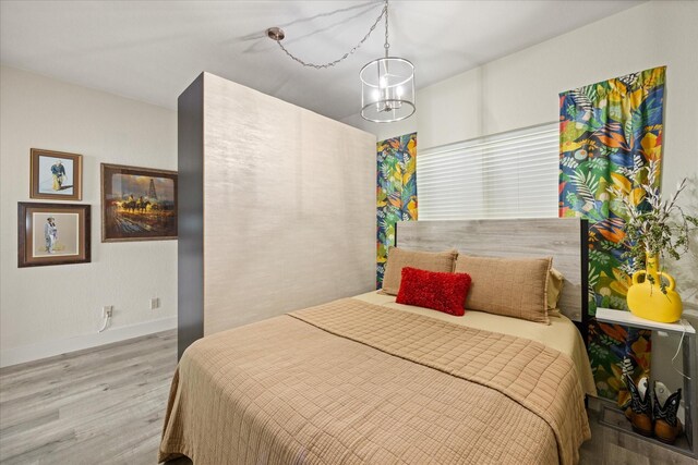 401 E Pearl St Unit 2105, Granbury, TX 76048 - bedroom with wood finished floors and baseboards