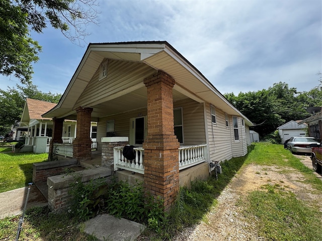 1205 W Arlington Ave, Fort Worth, TX 76110 - view of front of home featuring a porch