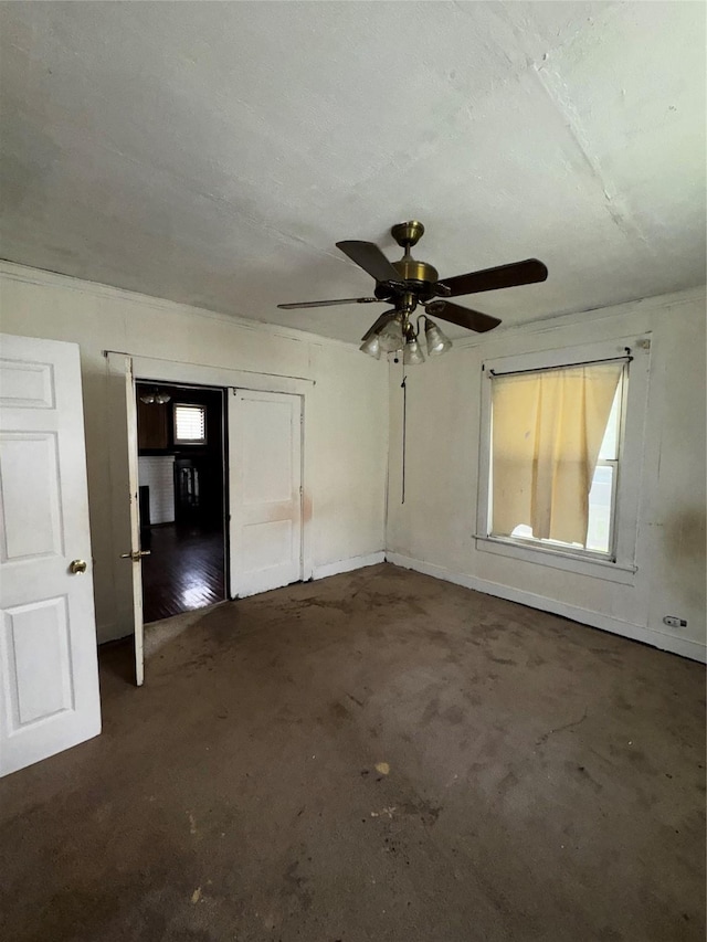 1205 W Arlington Ave, Fort Worth, TX 76110 - spare room featuring unfinished concrete floors, plenty of natural light, and ceiling fan
