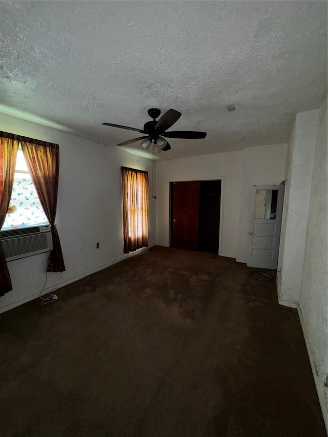 1205 W Arlington Ave, Fort Worth, TX 76110 - spare room featuring a textured ceiling, carpet floors, ceiling fan, and cooling unit