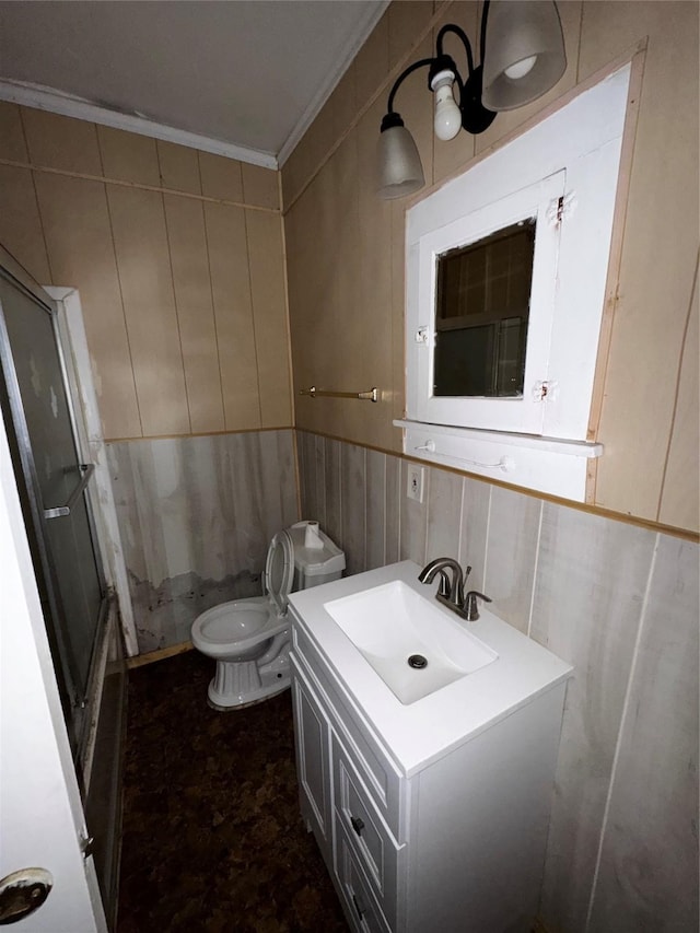 1205 W Arlington Ave, Fort Worth, TX 76110 - bathroom with vanity, toilet, crown molding, a wainscoted wall, and a shower