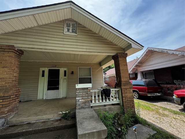 1205 W Arlington Ave, Fort Worth, TX 76110 - view of exterior entry featuring covered porch