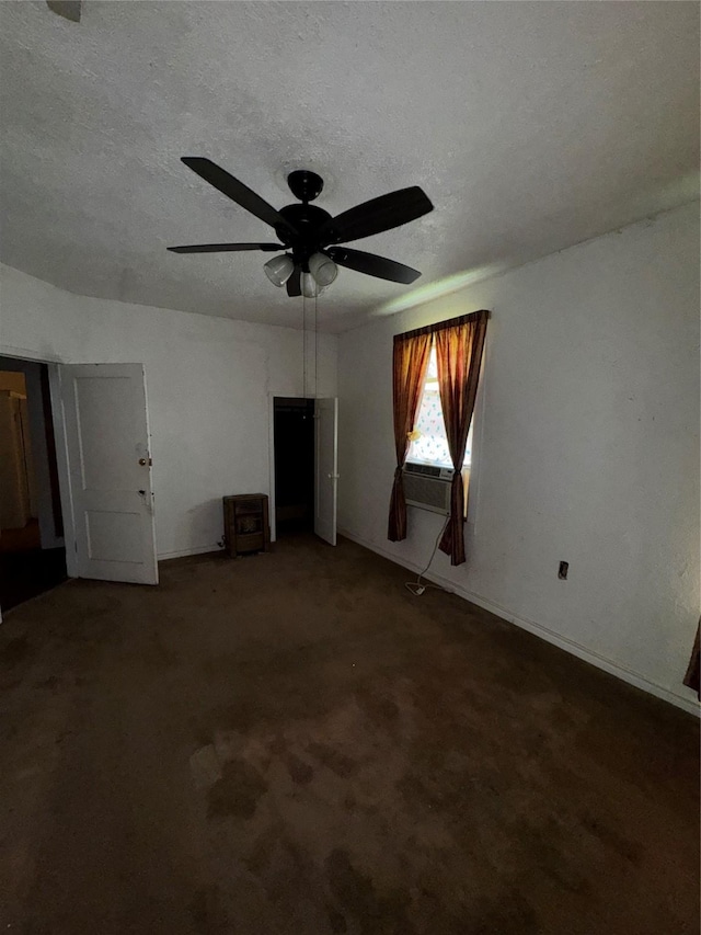 1205 W Arlington Ave, Fort Worth, TX 76110 - unfurnished living room with a ceiling fan, cooling unit, a textured ceiling, baseboards, and carpet flooring