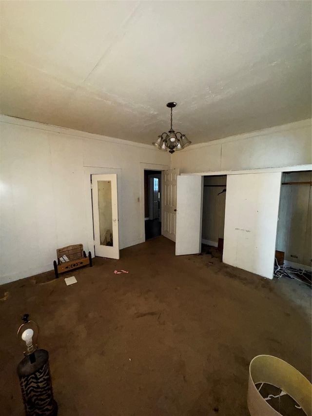 1205 W Arlington Ave, Fort Worth, TX 76110 - unfurnished bedroom with carpet flooring and a chandelier