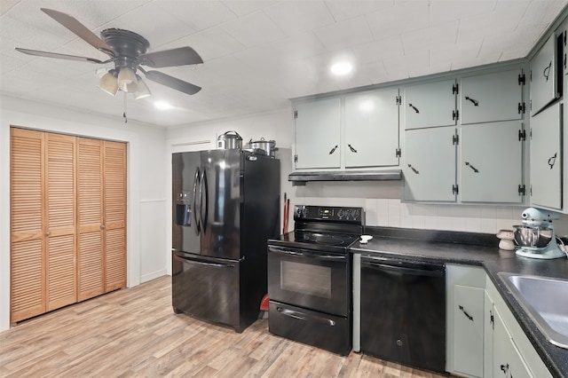 604 S Chestnut St, Winnsboro, TX 75494 - kitchen with black appliances, ceiling fan, a sink, dark countertops, and under cabinet range hood