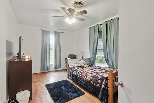 604 S Chestnut St, Winnsboro, TX 75494 - bedroom featuring hardwood / wood-style floors, ceiling fan, and baseboards