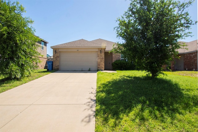 1407 Swan Ridge Dr, Sherman, TX 75092 - view of front facade with brick siding, an attached garage, driveway, and a front lawn