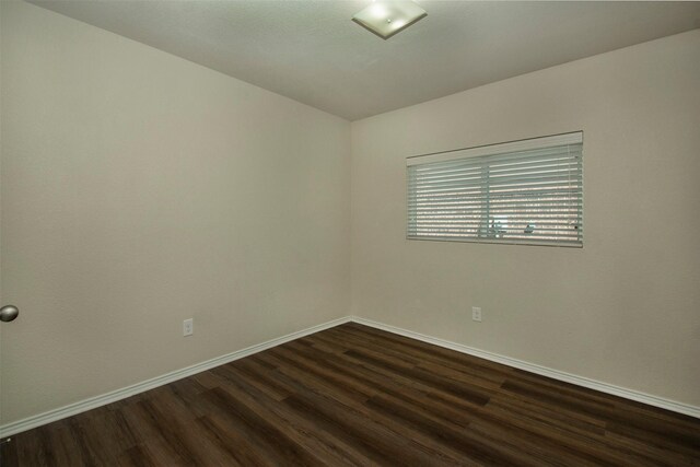 1407 Swan Ridge Dr, Sherman, TX 75092 - unfurnished room featuring dark wood finished floors and baseboards