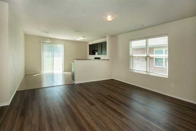 1407 Swan Ridge Dr, Sherman, TX 75092 - spare room with baseboards and dark wood-style floors