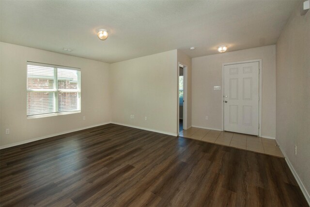 1407 Swan Ridge Dr, Sherman, TX 75092 - spare room featuring wood finished floors and baseboards