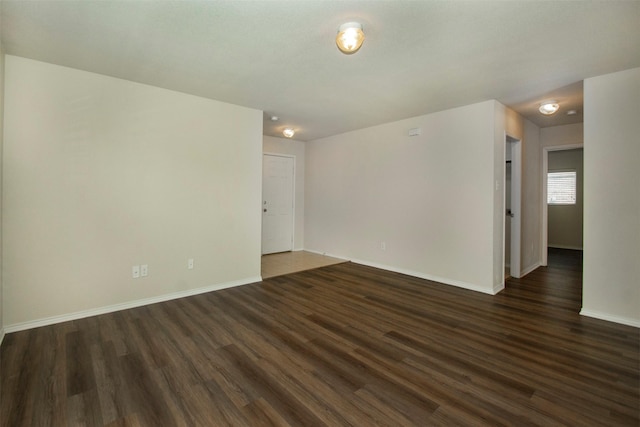 1407 Swan Ridge Dr, Sherman, TX 75092 - empty room with dark wood-style floors and baseboards