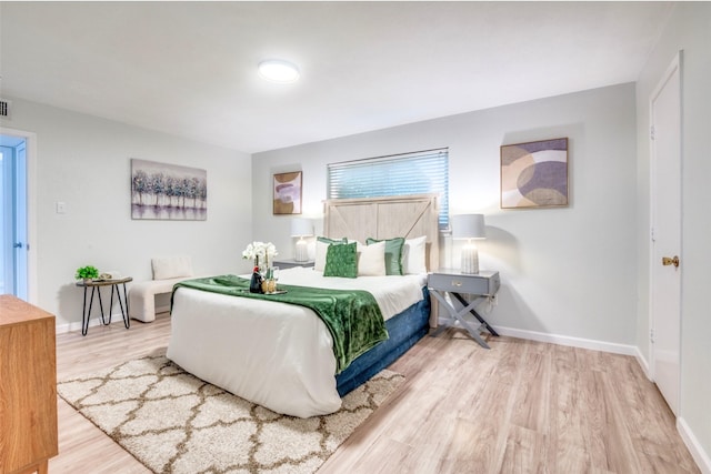 2209 Sheriff Dr, Grand Prairie, TX 75051 - bedroom with wood finished floors and baseboards