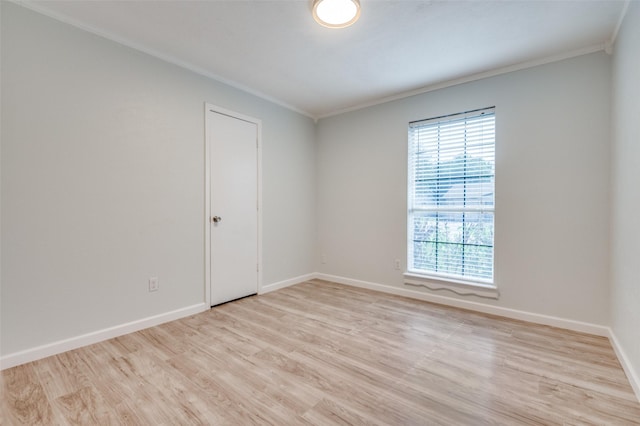 2209 Sheriff Dr, Grand Prairie, TX 75051 - spare room with crown molding, light wood-type flooring, and baseboards