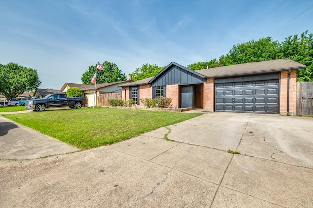 2209 Sheriff Dr, Grand Prairie, TX 75051 - view of front of home featuring brick siding, driveway, a garage, and board and batten siding