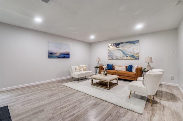 2209 Sheriff Dr, Grand Prairie, TX 75051 - living room with light wood finished floors, recessed lighting, and baseboards