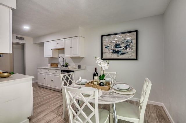 2209 Sheriff Dr, Grand Prairie, TX 75051 - dining room with light wood-type flooring, baseboards, and recessed lighting
