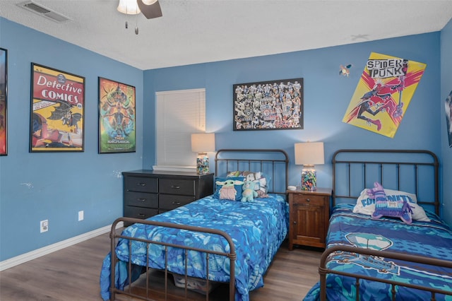 115 Mill Pond Rd, Denton, TX 76209 - bedroom featuring wood finished floors, baseboards, ceiling fan, and a textured ceiling