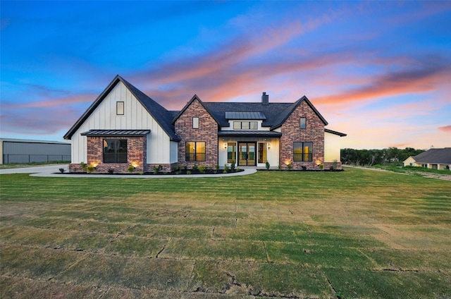 500 Longhorn Dr, Springtown, TX 76082 - modern farmhouse featuring a standing seam roof, a chimney, a yard, and metal roof