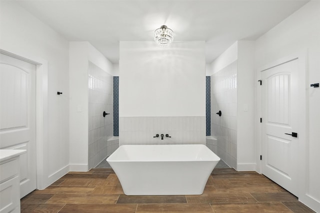 500 Longhorn Dr, Springtown, TX 76082 - full bath featuring a walk in shower, a freestanding bath, and wood finished floors