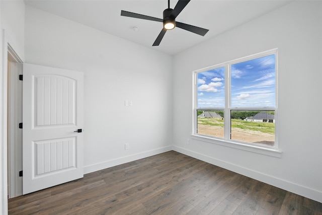 500 Longhorn Dr, Springtown, TX 76082 - spare room featuring baseboards, dark wood-type flooring, and a ceiling fan