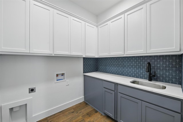 500 Longhorn Dr, Springtown, TX 76082 - laundry area featuring hookup for a washing machine, hookup for an electric dryer, dark wood-style floors, cabinet space, and baseboards
