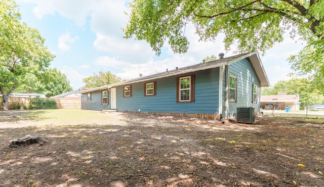 103 N 6th St E, Dawson, TX 76639 - back of house featuring central AC and a fenced backyard