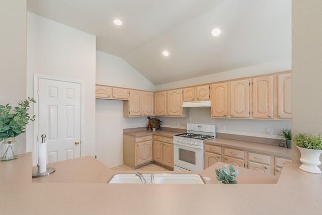 8301 Clearbrook Dr, Fort Worth, TX 76123 - kitchen with white range with gas cooktop, under cabinet range hood, light brown cabinetry, a sink, and lofted ceiling