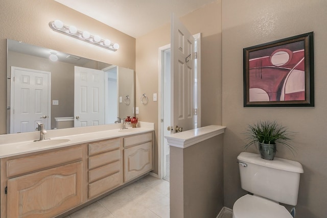 8301 Clearbrook Dr, Fort Worth, TX 76123 - bathroom featuring tile patterned floors, toilet, and double vanity