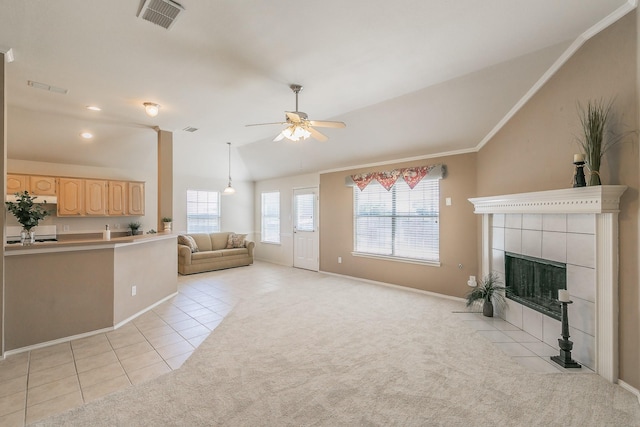 8301 Clearbrook Dr, Fort Worth, TX 76123 - unfurnished living room featuring lofted ceiling, light tile patterned floors, ceiling fan, baseboards, and a tiled fireplace